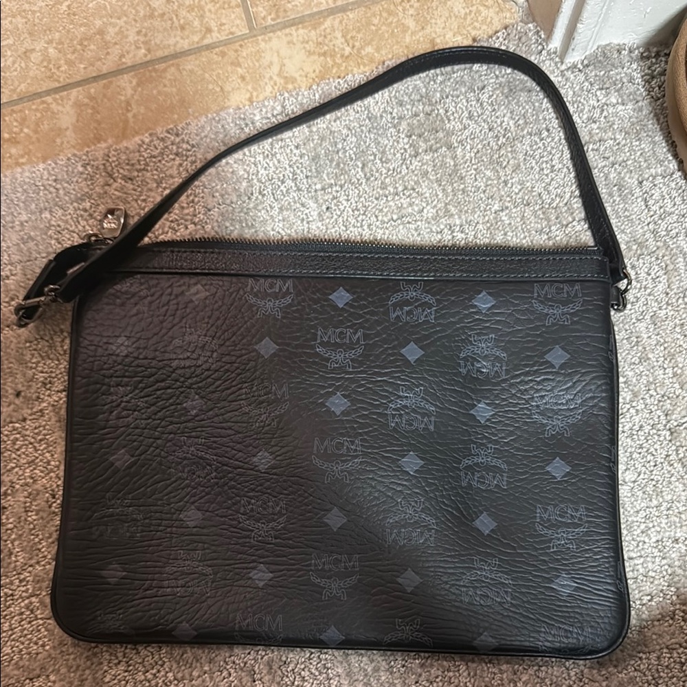 MCM Black Leather Clutch with Monogram Pattern